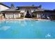 Inviting community pool with surrounding lounge chairs at 17104 Carrington Park Dr # 528, Tampa, FL 33647