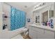 Bathroom with bathtub, shower, and vanity with sink at 17104 Carrington Park Dr # 528, Tampa, FL 33647