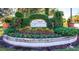 Community entrance with a welcoming sign and lush landscaping at 17104 Carrington Park Dr # 528, Tampa, FL 33647