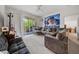 Comfortable living room with sectional sofa and access to a private balcony at 17104 Carrington Park Dr # 528, Tampa, FL 33647