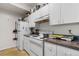Kitchen with white cabinets, granite countertops, and appliances at 17104 Carrington Park Dr # 528, Tampa, FL 33647