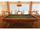 Game room with a pool table and comfortable seating at 17104 Carrington Park Dr # 528, Tampa, FL 33647