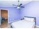 Bedroom with double bed, wood floors, and ceiling fan at 18940 Emerald Ridge Dr, Hudson, FL 34667