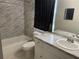 Bathroom with tub, toilet, and vanity at 18940 Emerald Ridge Dr, Hudson, FL 34667