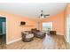 Living room with wood floors and comfy seating at 18940 Emerald Ridge Dr, Hudson, FL 34667