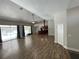 Large living room with high ceilings and view of the kitchen and pool at 18940 Emerald Ridge Dr, Hudson, FL 34667