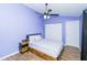 Bedroom with double bed, wood floors, and ceiling fan at 18940 Emerald Ridge Dr, Hudson, FL 34667