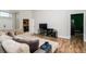 Spacious living room with plush sectional sofa and wood floors at 18940 Emerald Ridge Dr, Hudson, FL 34667