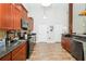 Well-equipped kitchen featuring wood cabinets and granite countertops at 18940 Emerald Ridge Dr, Hudson, FL 34667