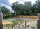 Backyard with firepit and wooden fence at 18940 Emerald Ridge Dr, Hudson, FL 34667