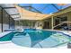 Inviting refreshing pool with a shaded patio area at 18940 Emerald Ridge Dr, Hudson, FL 34667
