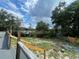 Backyard with firepit and partial wooden fence at 18940 Emerald Ridge Dr, Hudson, FL 34667