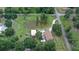 Aerial view showing house, detached garage, and pond at 7029 Dormany Loop, Plant City, FL 33565