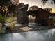 Serene backyard waterfall feature with stone accents at 7029 Dormany Loop, Plant City, FL 33565