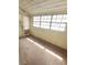 Bright sunroom featuring multiple windows at 8004 N Klondyke St, Tampa, FL 33604