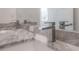 Bathroom features a double vanity with granite countertop and modern faucets at 5530 N 9Th St # 5, Tampa, FL 33604