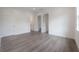 Bright, open bedroom featuring hardwood floors and multiple closets at 5530 N 9Th St # 5, Tampa, FL 33604