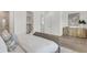 Bright bedroom featuring hardwood floors, a comfortable bed, and closet access at 5530 N 9Th St # 5, Tampa, FL 33604