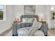 Cozy bedroom featuring a stylish gray bed frame, soft lighting, and comfortable linens at 5530 N 9Th St # 5, Tampa, FL 33604