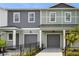 Charming two-story townhomes with individual garages and well-manicured landscaping at 5530 N 9Th St # 5, Tampa, FL 33604