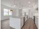 Open concept kitchen with pendant lights, large island and stainless steel appliances at 5530 N 9Th St # 5, Tampa, FL 33604