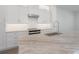 Kitchen with white cabinets, stainless steel appliances and marble countertops at 5530 N 9Th St # 5, Tampa, FL 33604