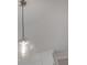 Pendant light fixture with glass shade and metal detail at 5530 N 9Th St # 5, Tampa, FL 33604