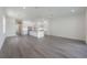 Open concept living room and kitchen with grey flooring and white walls at 5530 N 9Th St # 5, Tampa, FL 33604