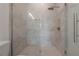 Modern shower with glass enclosure and marble-look tile at 5530 N 9Th St # 5, Tampa, FL 33604