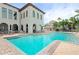 Community pool with adjacent patio and bar area at 6030 Printery St # 105, Tampa, FL 33616