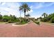 Landscaped entrance to the community with brick pavers at 6030 Printery St # 105, Tampa, FL 33616