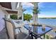 Waterfront balcony with seating for two and stunning water views at 247 Pompano Se Dr # D, St Petersburg, FL 33705