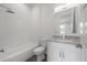 Bathroom with white vanity, tub, and modern tile at 5530 N 9Th St # 5, Tampa, FL 33604