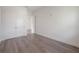 Bright bedroom with double doors and wood-look flooring at 5530 N 9Th St # 5, Tampa, FL 33604