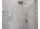 Walk-in shower with marble-look tile and rainfall shower head at 5530 N 9Th St # 5, Tampa, FL 33604