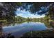 Scenic lake view with lush greenery and reflections of the sky at 5530 N 9Th St # 5, Tampa, FL 33604