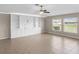 Spacious living room with large windows and tile floors at 5474 Leslie Canyon Dr, Wimauma, FL 33598