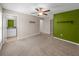 Bright bedroom with a ceiling fan and access to a bathroom at 5474 Leslie Canyon Dr, Wimauma, FL 33598