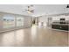 Open concept kitchen and living area with modern appliances at 5474 Leslie Canyon Dr, Wimauma, FL 33598