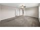 Primary bedroom with carpet flooring and access to bathroom at 5474 Leslie Canyon Dr, Wimauma, FL 33598