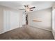 Bedroom with ceiling fan and built-in shelving at 5474 Leslie Canyon Dr, Wimauma, FL 33598