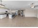 Open concept kitchen with granite countertops and stainless steel appliances at 5474 Leslie Canyon Dr, Wimauma, FL 33598