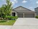 Two-story house with three-car garage at 5474 Leslie Canyon Dr, Wimauma, FL 33598