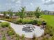 Picnic area with table, grill, and landscaped walkway at 5474 Leslie Canyon Dr, Wimauma, FL 33598