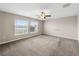 Spacious bedroom with carpet and large windows at 5474 Leslie Canyon Dr, Wimauma, FL 33598