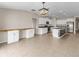Open concept kitchen with island and built in desk area at 5474 Leslie Canyon Dr, Wimauma, FL 33598