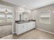 Double vanity bathroom with granite countertop, and large walk in shower at 5474 Leslie Canyon Dr, Wimauma, FL 33598