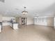 Open concept Gathering room with built in shelving and kitchen view at 5474 Leslie Canyon Dr, Wimauma, FL 33598