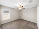 Well-lit bedroom with ceiling fan and window at 5474 Leslie Canyon Dr, Wimauma, FL 33598