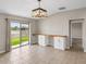 Kitchen dining area with view of backyard and sliding glass doors at 5474 Leslie Canyon Dr, Wimauma, FL 33598